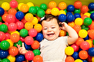 baby in ball pit