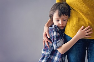 boy hugging mom