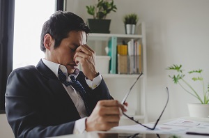 businessman feeling stressed.jpeg