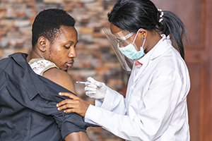 doctor giving vaccine to patient