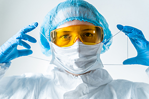 doctor putting on mask