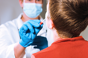 doctor swabbing child's nose