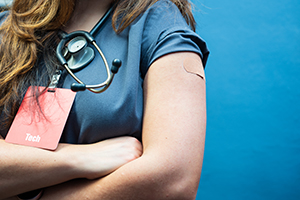 female healthcare worker with badge