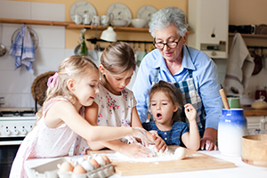 grandma baking with three girls