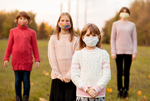 group of children wearing masks