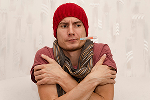 man with fever and cold