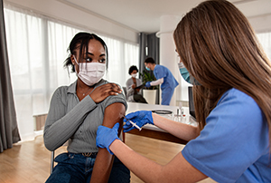 nurse giving vaccine