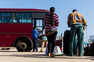 people boarding bus in africa