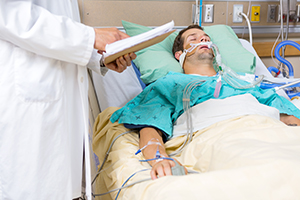 sick man in hospital bed