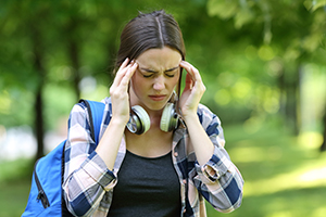 student with headache