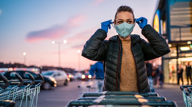 https://stock.adobe.com/images/a-woman-wears-medical-protective-gloves-and-a-mask-while-shopping-groceries/332517690 