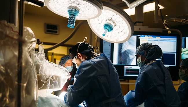 Brian Scansen performs a minimally invasive procedure at the CSU James L. Voss Veterinary Teaching Hospital. (Photo Credit: Kellen Bakovich/CSU photo)