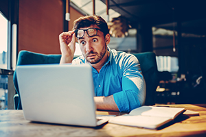 surprised man with glasses