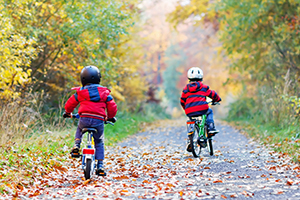 two children riding bikes