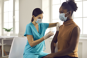 woman getting covid vaccine