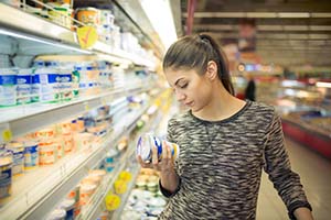 woman looking at food in store