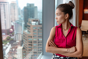 woman looking out window