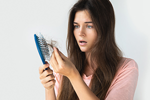 woman losing hair