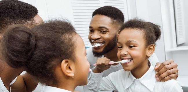 https://stock.adobe.com/images/african-american-girl-brushing-teeth-together-with-dad/247146126
