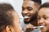 https://stock.adobe.com/images/african-american-girl-brushing-teeth-together-with-dad/247146126